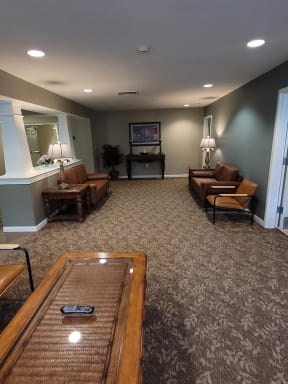 a living room with couches chairs and a tv