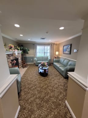 a living room with couches and a fireplace