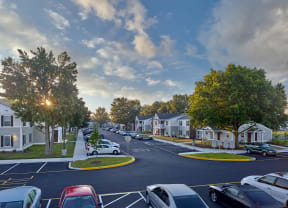 a street in a neighborhood with houses and cars