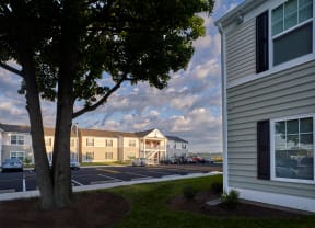 a view of an apartment complex from a parking lot