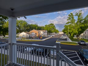 a balcony with a view of a street