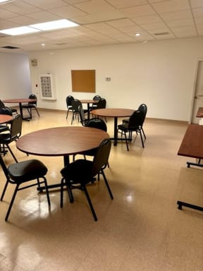 a large room with tables and chairs