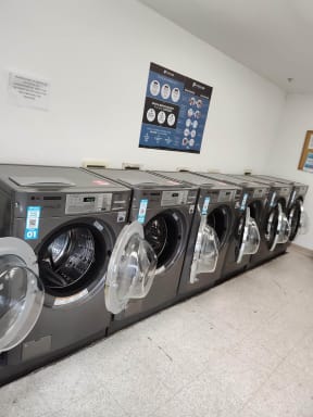 a row of washing machines in a laundromat