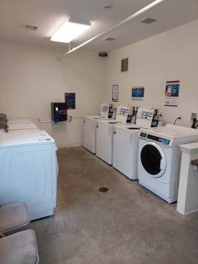 a laundry room with a washer and dryer in it