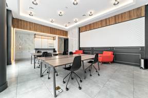 a conference room with a large table and chairs