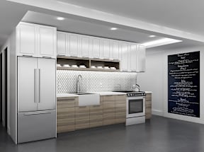 A modern kitchen with a refrigerator, sink, and cabinets.