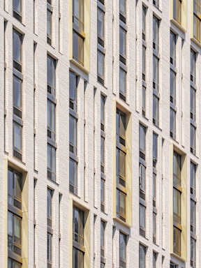 the facade of a building with many windows at The Lively, Jersey City, NJ