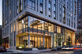 a rendering of a building on a city street at The Lively, Jersey City, 07302