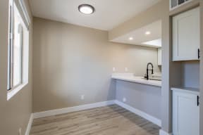 a kitchen with a sink and a window