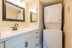 a bathroom with a washer and dryer