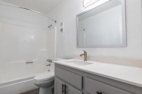 a bathroom with a sink and a toilet  at Sofia Apartments, Tempe, AZ, 85283