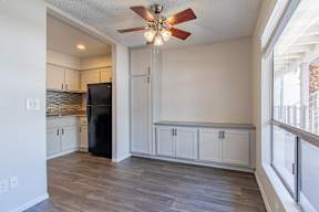 a kitchen and living room with a ceiling fan at Sofia Apartments, Tempe, AZ at Sofia Apartments, Tempe, 85283