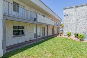 Apartment building with a green lawn in front at Sofia Apartments, Tempe, 85283