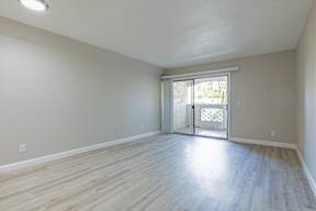 A room with a sliding glass door leading to a balcony at Sofia Apartments, Tempe, 85283