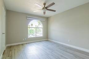 A room with a ceiling fan and a window with blinds at Sofia Apartments, Tempe, 85283
