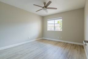 A room with a ceiling fan and a window at Sofia Apartments, Tempe, 85283