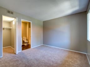 an empty room with a toilet and a closet