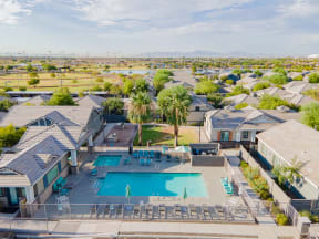 an aerial view of a swimming pool and a group of houses at Villas on Olive, Peoria, Arizona