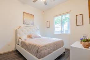 a bedroom with a bed and a window at Villas on Olive, Peoria, Arizona