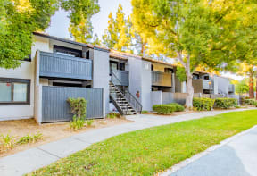 exterior view of an apartment building with a sidewalk and trees at Metro 3610, California