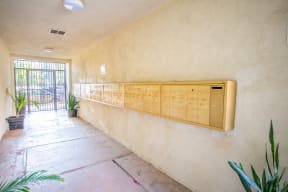 a long row of wooden cabinets on the wall of a building