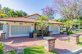 A house with a red tiled roof and a white garage door at Metro 3610, Riverside, 92505