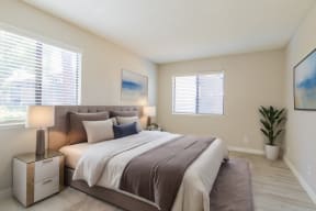 a bedroom with a bed and two windows at Metro 3610, California