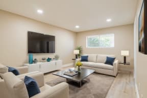 a living room with couches and a coffee table