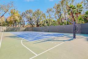 the basketball court is equipped with a basketball hoop and a net
