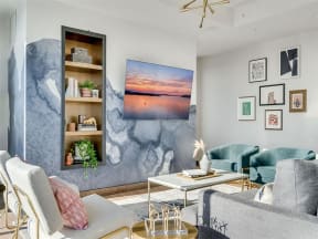 a living room with couches and chairs and a table