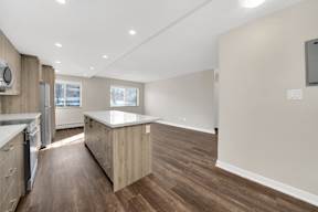 a kitchen and living room in a 555 waverly unit