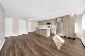 a kitchen and dining area in a 555 waverly unit