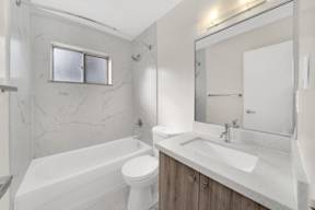 a bathroom with a sink toilet and bathtub