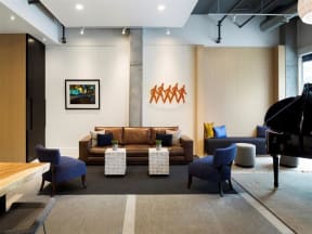 Lobby with couch, chairs and artwork