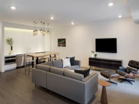 Clubroom with kitchen, couch and TV