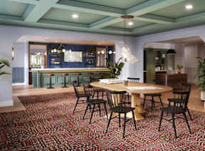 a dining room with a table and chairs