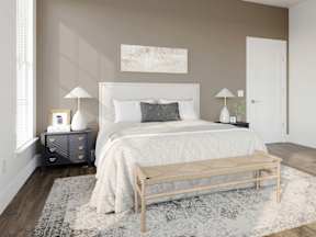 a bedroom with a white bed and a rug