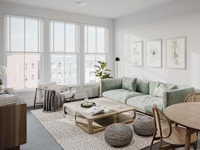 a living room with a green couch and a coffee table
