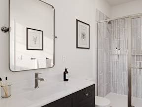 a bathroom with a shower and a sink and a mirror
