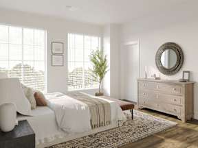 a bedroom with a bed and a dresser