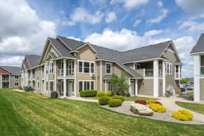 a large house with a yard and grass