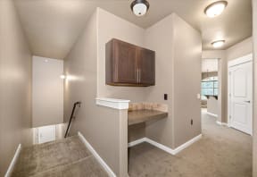 an empty room with a counter in the corner of a room