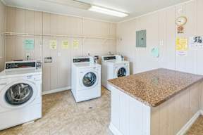 A laundry room with a washer and dryer in it.