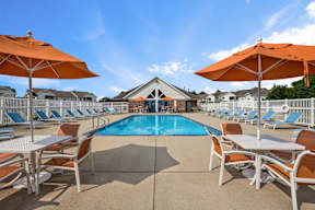 Resort-style pool and seating area at Arbor Crossings Muskegon MI