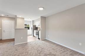 Open living room and kitchen layout at Arbor Crossings Muskegon MI