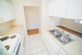 a kitchen with a sink and a stove