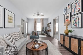 a living room filled with furniture and a ceiling fan at the Vue apartments in Indianapolis