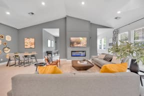 community living room with a couch and a fireplace at spire apartments in charlotte nc