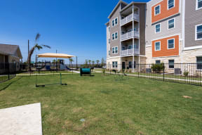Dog park with a fence at Promenade apartments