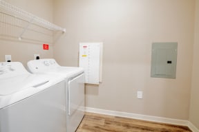 Room with a washer and dryer at Trillium apartments